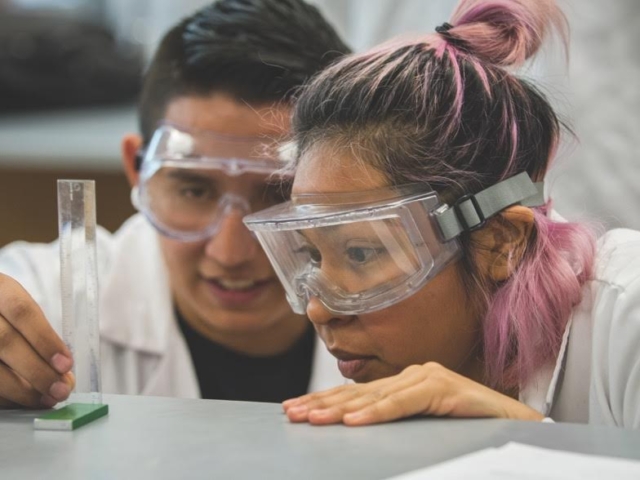 Two students conducting lab experiment at Chaffey College