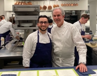 Chaffey college culinary arts alumnus with chef in kitchen.