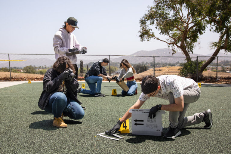 Students studying crime scene investigation